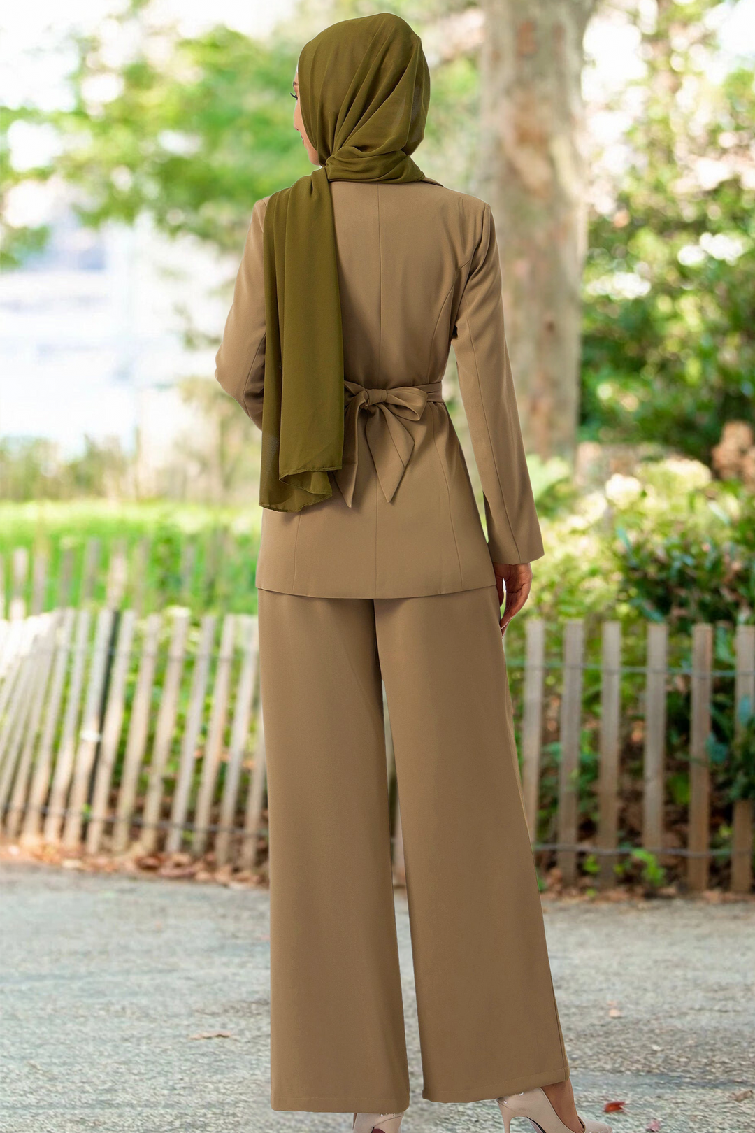 Modest women’s taupe jacket and pants suit set paired with a stylish hijab