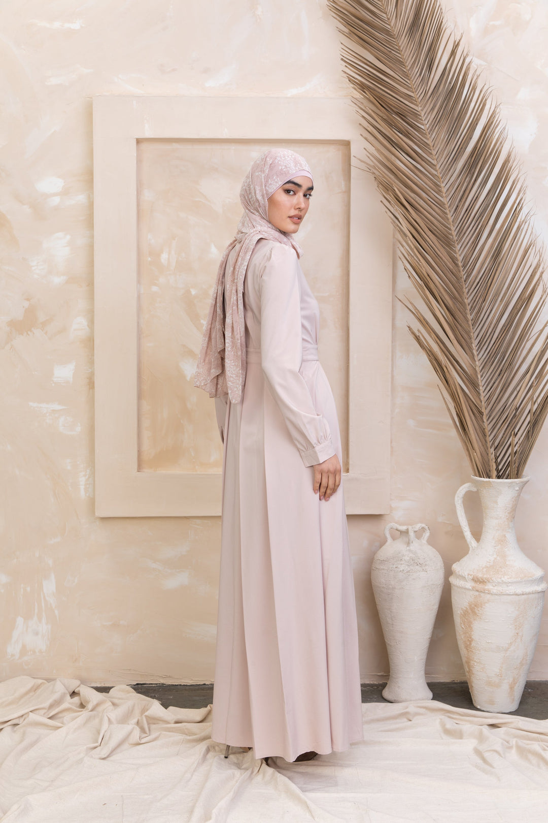 Woman in Taupe Lattice Abaya Maxi Dress showcasing urban modesty with zipper closure