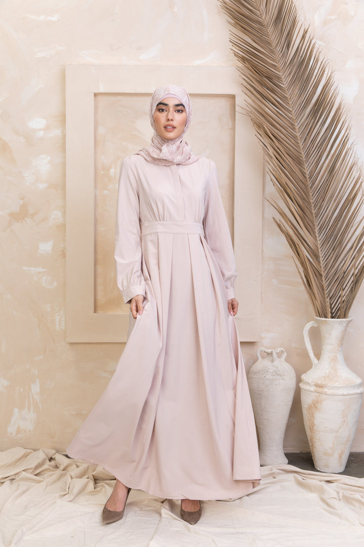 Woman wearing a Taupe Lattice Abaya Maxi Dress with zipper closure for urban modesty