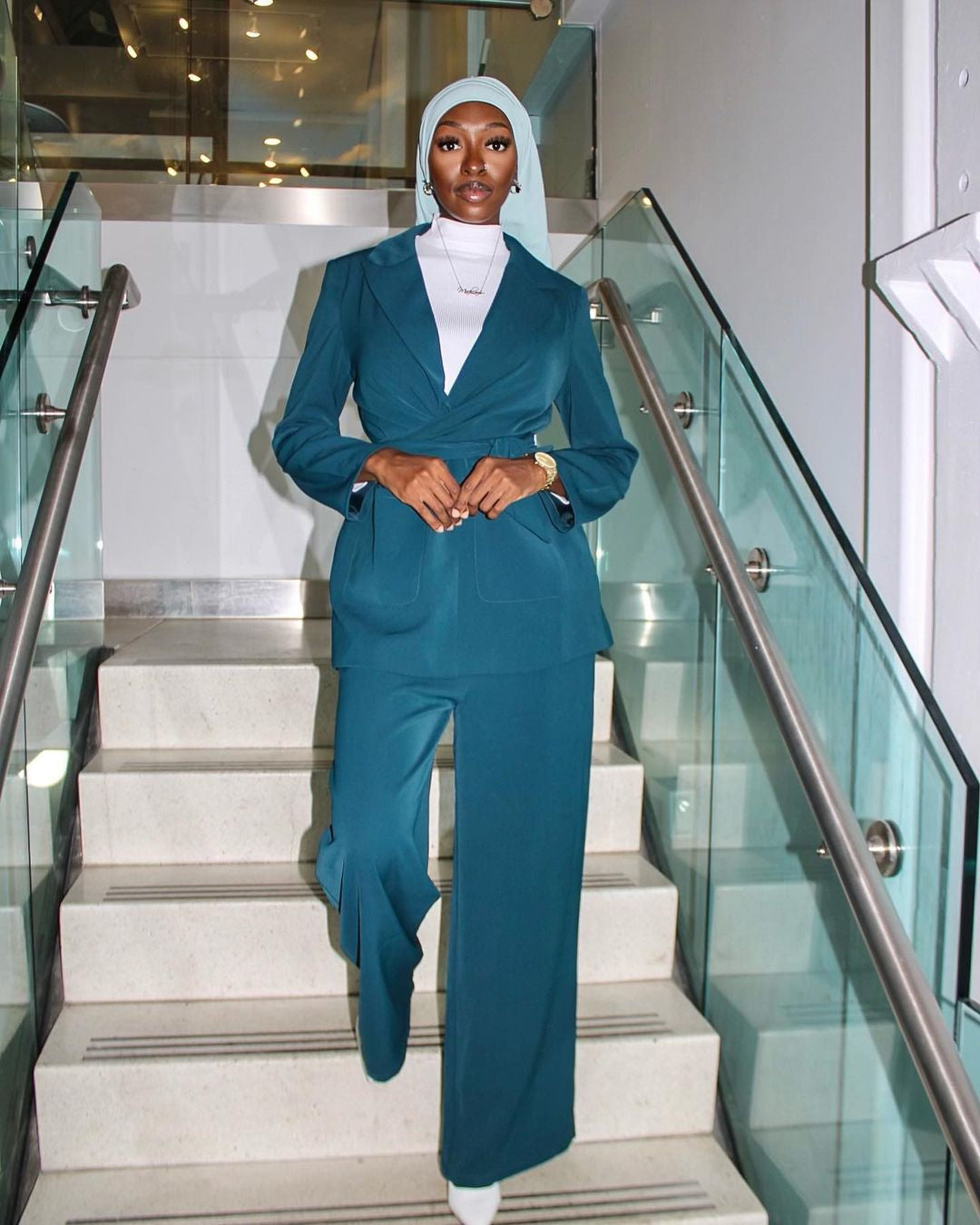 Woman wearing a stylish Teal Jacket and Pants Suit Set on CLEARANCE sale