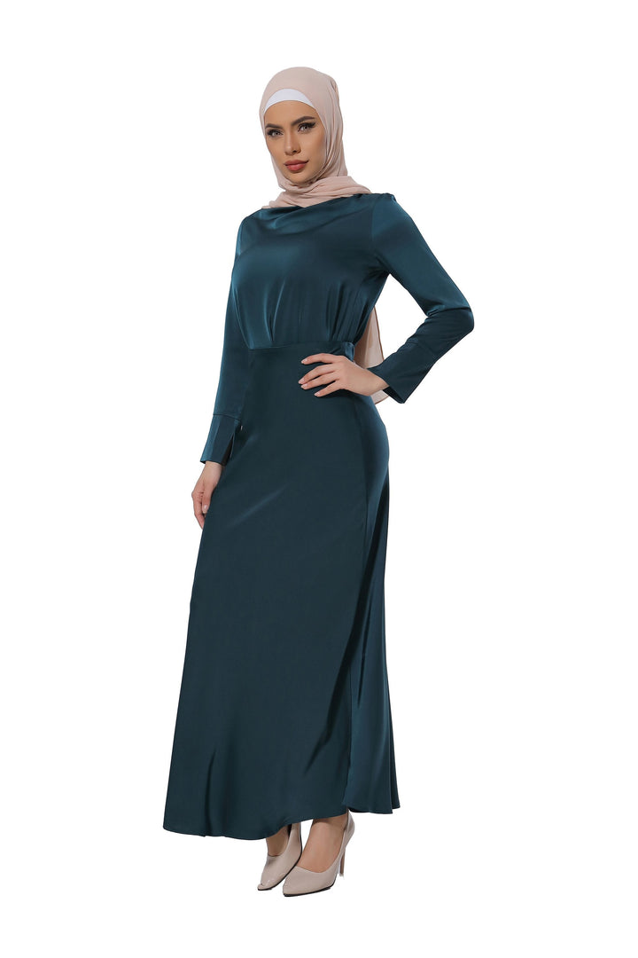 Emerald green modest dress with hijab styled with a teal satin long sleeve skirt set