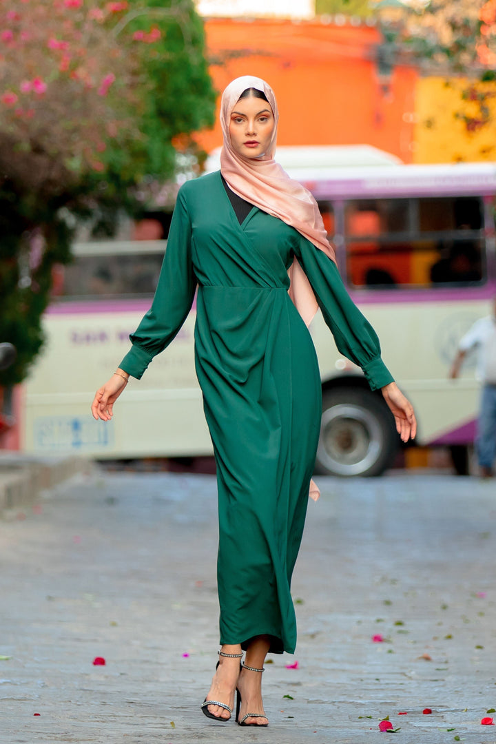 Emerald green wrap maxi dress with long sleeves and criss cross neckline style