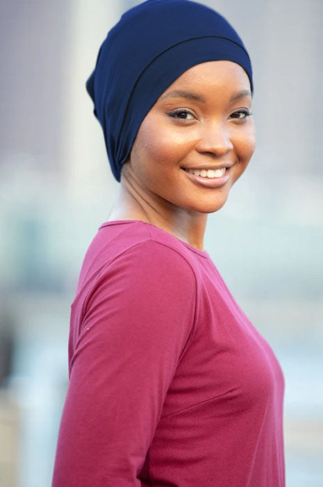 Smiling woman wearing Tube Hijab Underscarf showcasing style and comfort