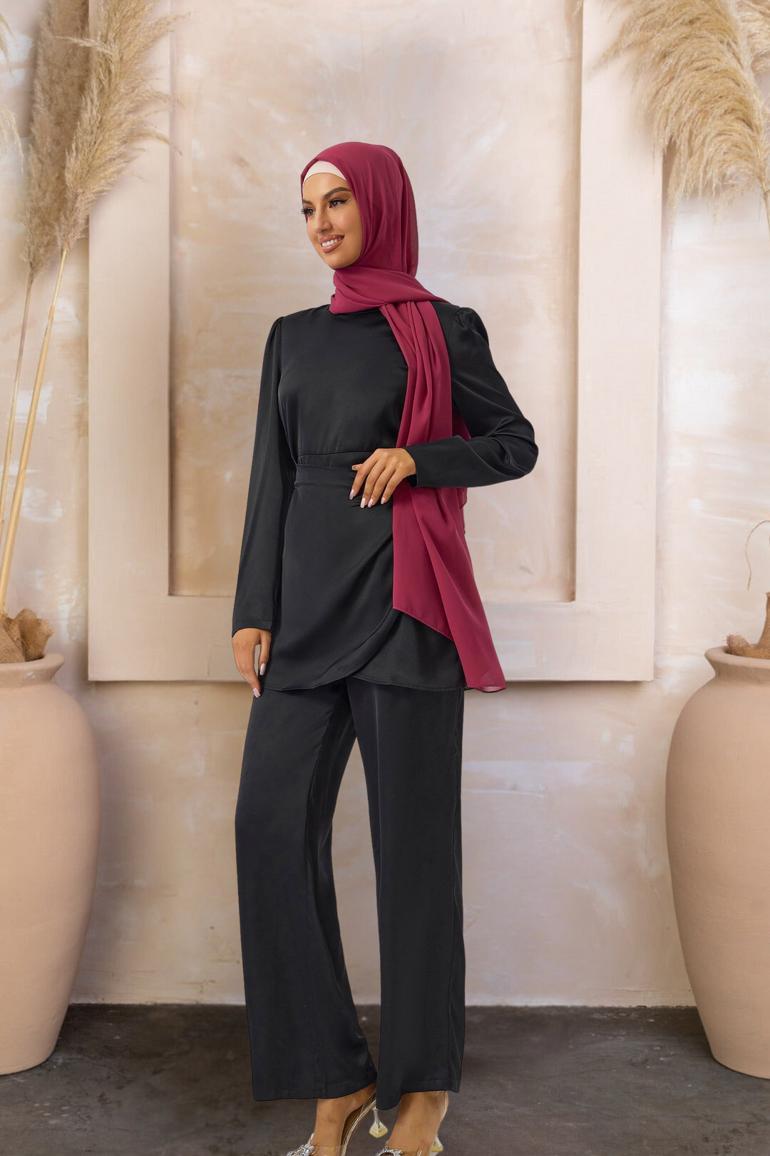 Woman in black satin side wrap tunic and pants with maroon hijab