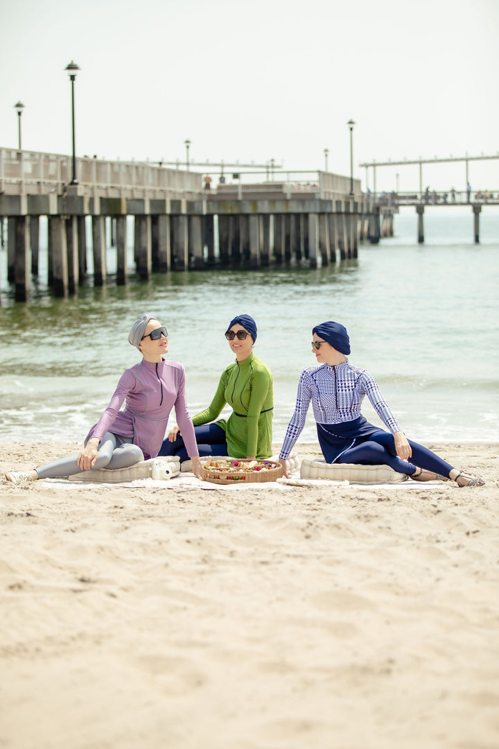 Three women in blue houndstooth print 3-piece modest burkini swimsuit