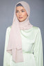 Woman in light pink Latte Chiffon Hijab and light green dress