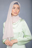 Woman in latte chiffon hijab and light green satin dress
