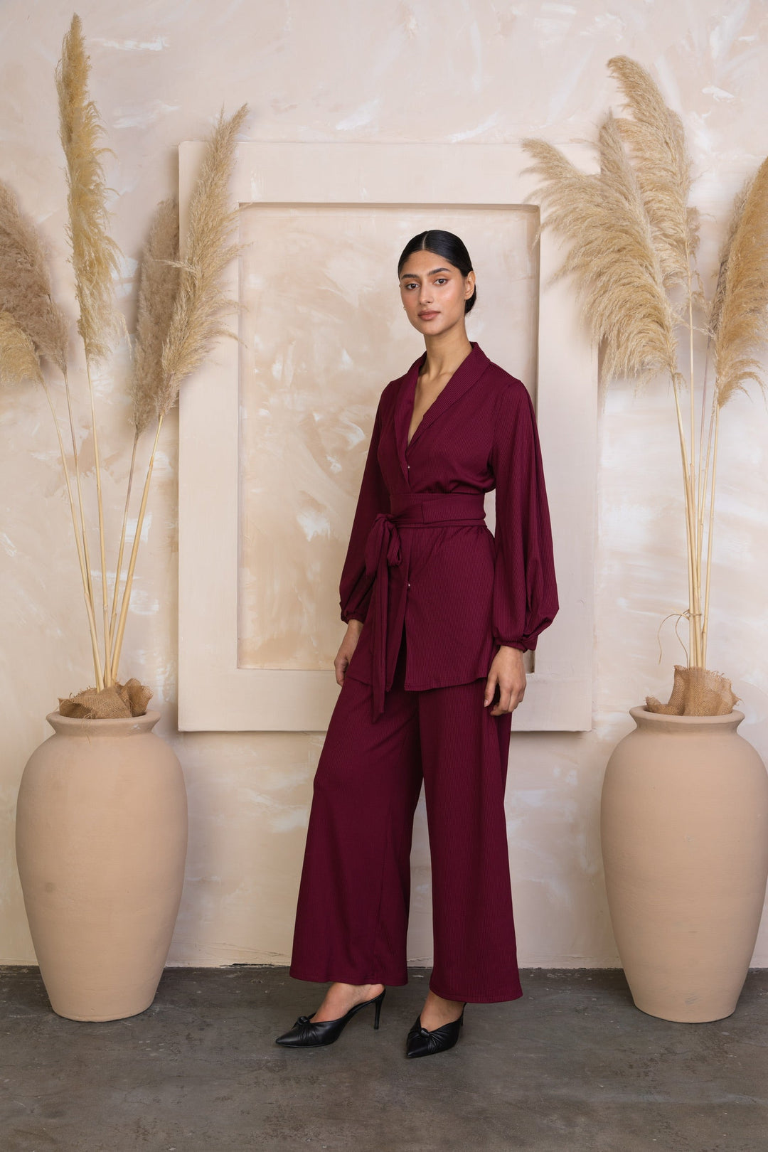Burgundy belted pantsuit in maroon ribbed tunic and pants set