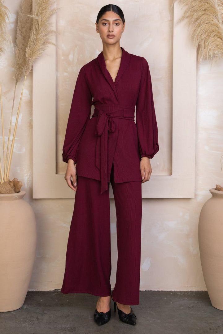 Burgundy wrap-style pantsuit in maroon belted ribbed tunic and pants set