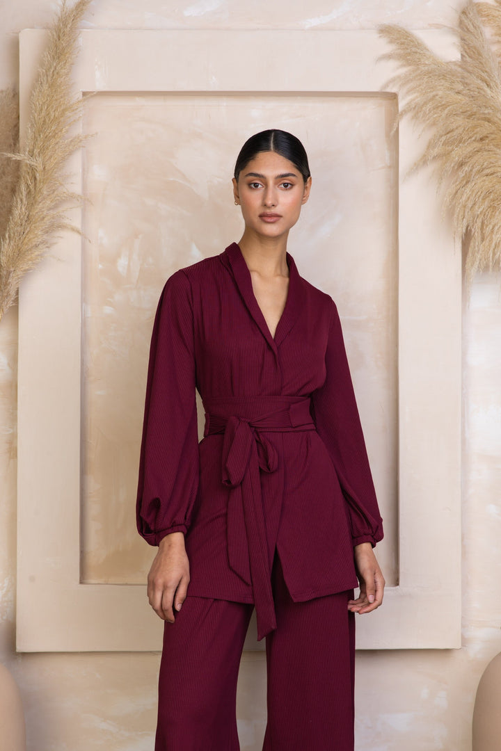 Burgundy belted pantsuit in maroon ribbed tunic and pants set