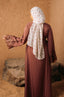 Woman in brown dress and floral hijab wearing purple lace sleeve abaya