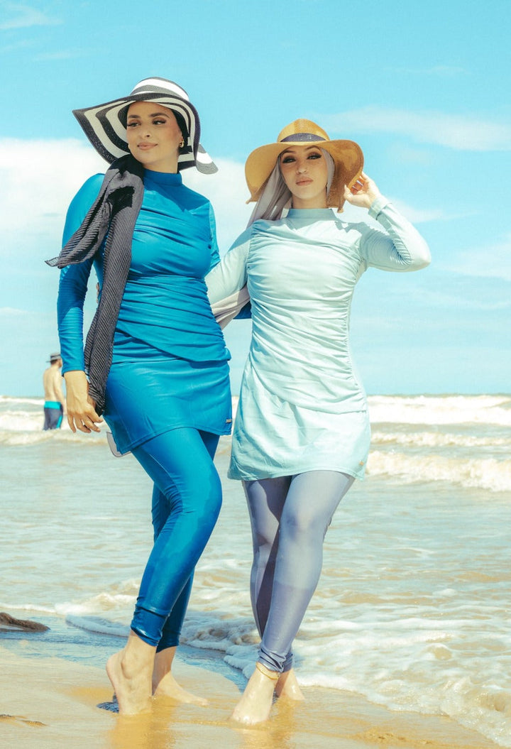 Two women modeling ruched 3-piece modest swimsuit on clearance