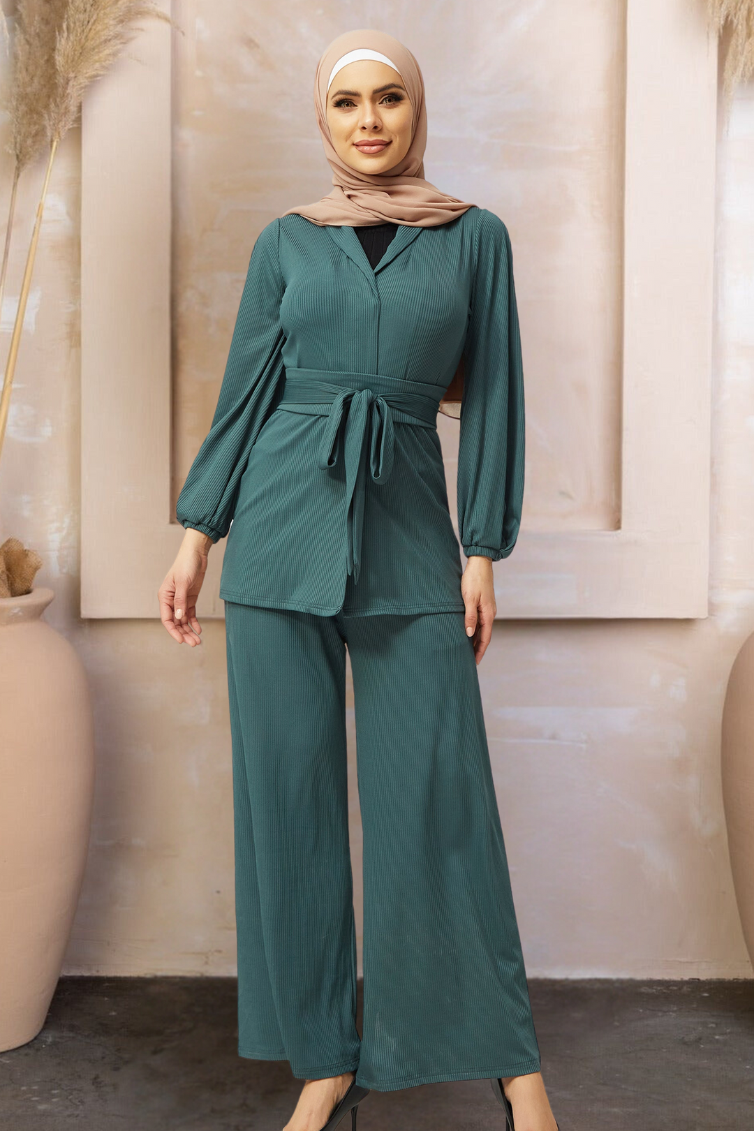 Woman in green belted pleated pantsuit and hijab from Teal Ribbed Set