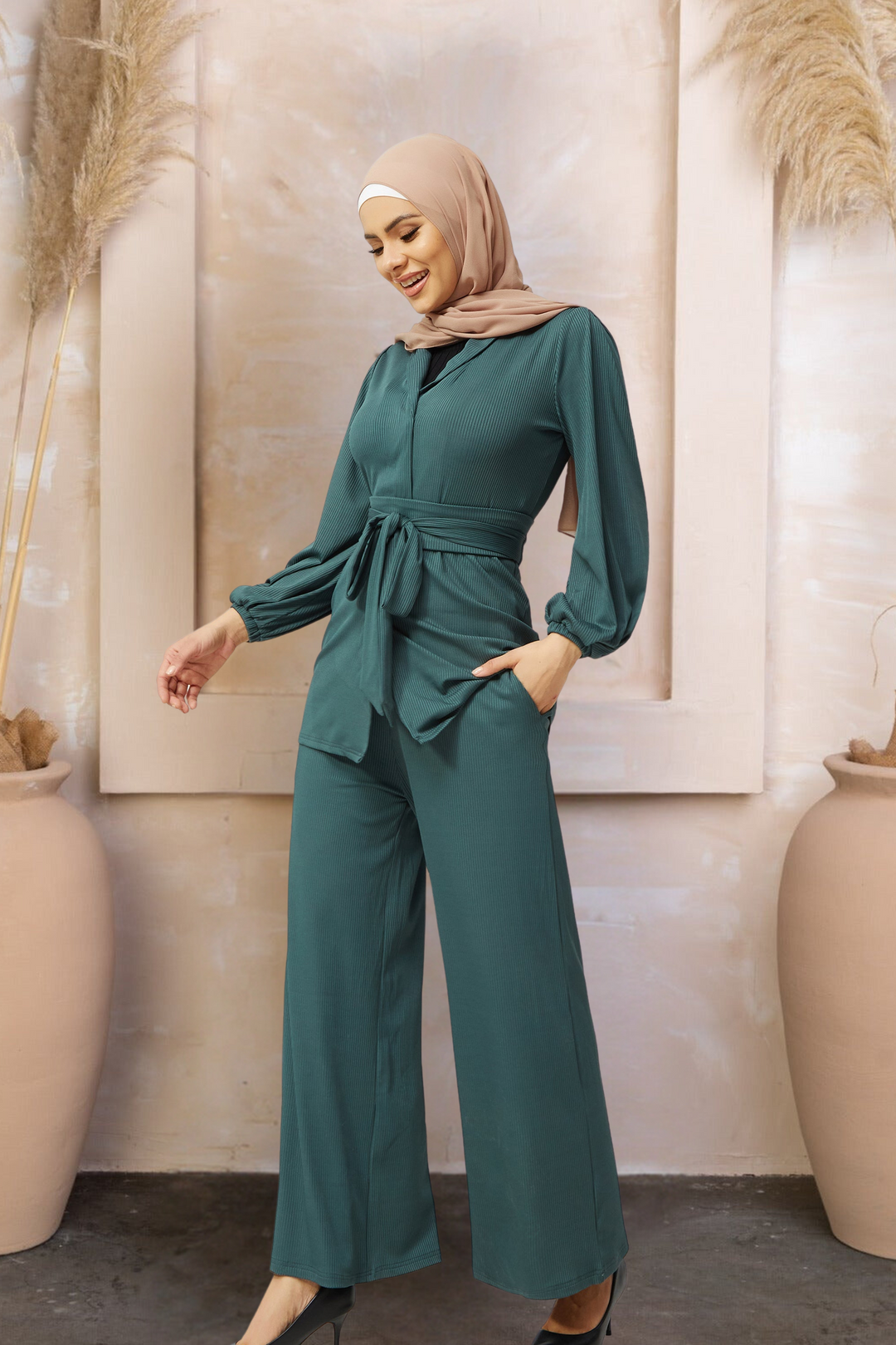 Emerald green belted jumpsuit in teal ribbed tunic and pants set