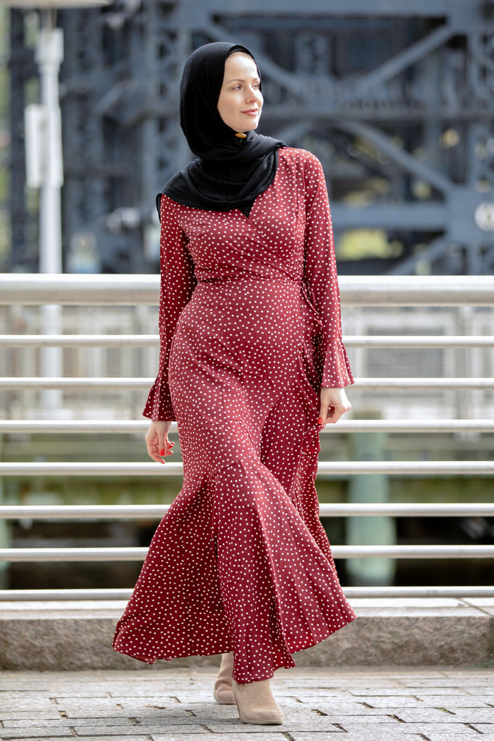 a woman in a red polka dot dress