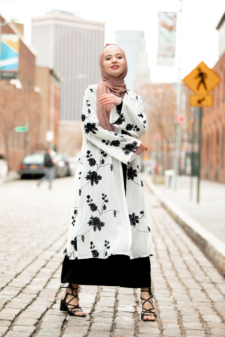 Woman in floral kimono and hijab with black embroidered sheer midi cardigan