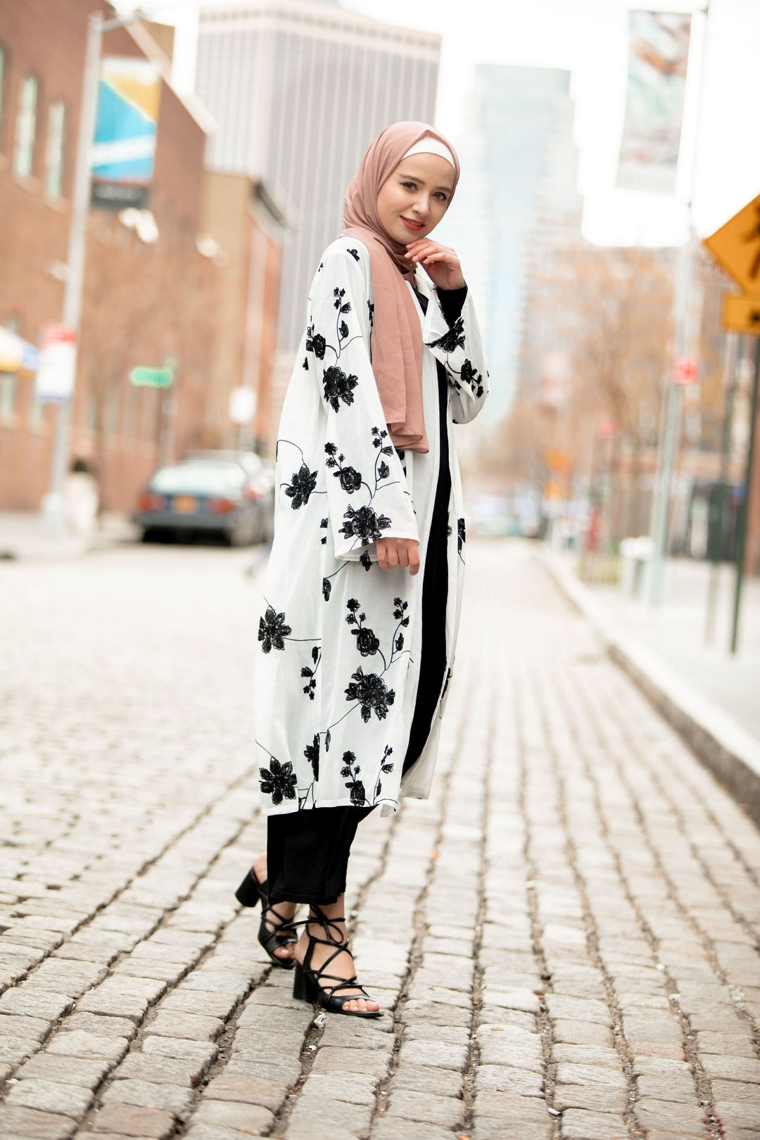 Floral-patterned white cardigan, a black embroidered sheer midi cardigan for stylish layering