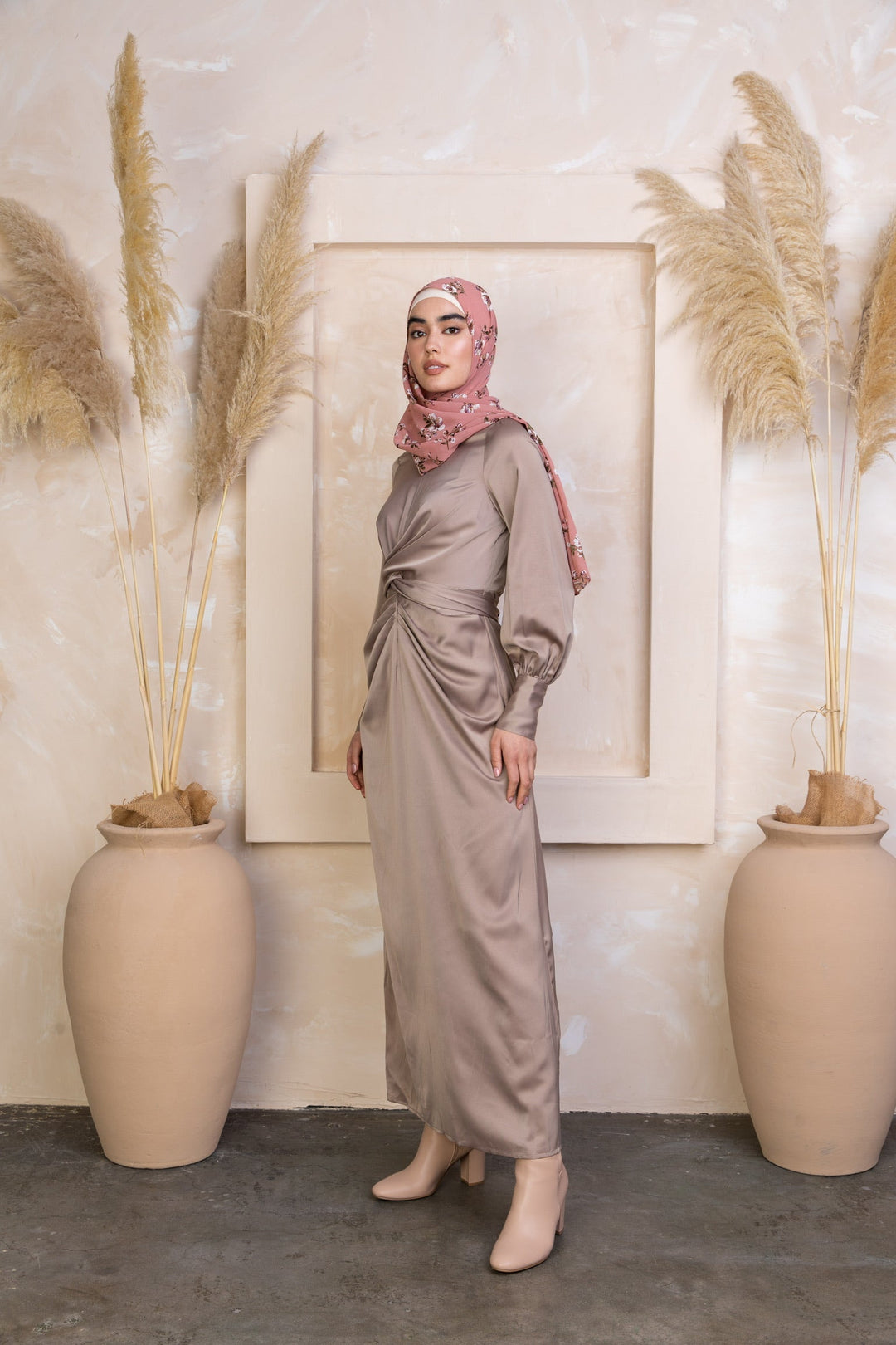 Woman wearing Zana Criss Cross Satin Maxi Dress in a stylish satin dress and hijab