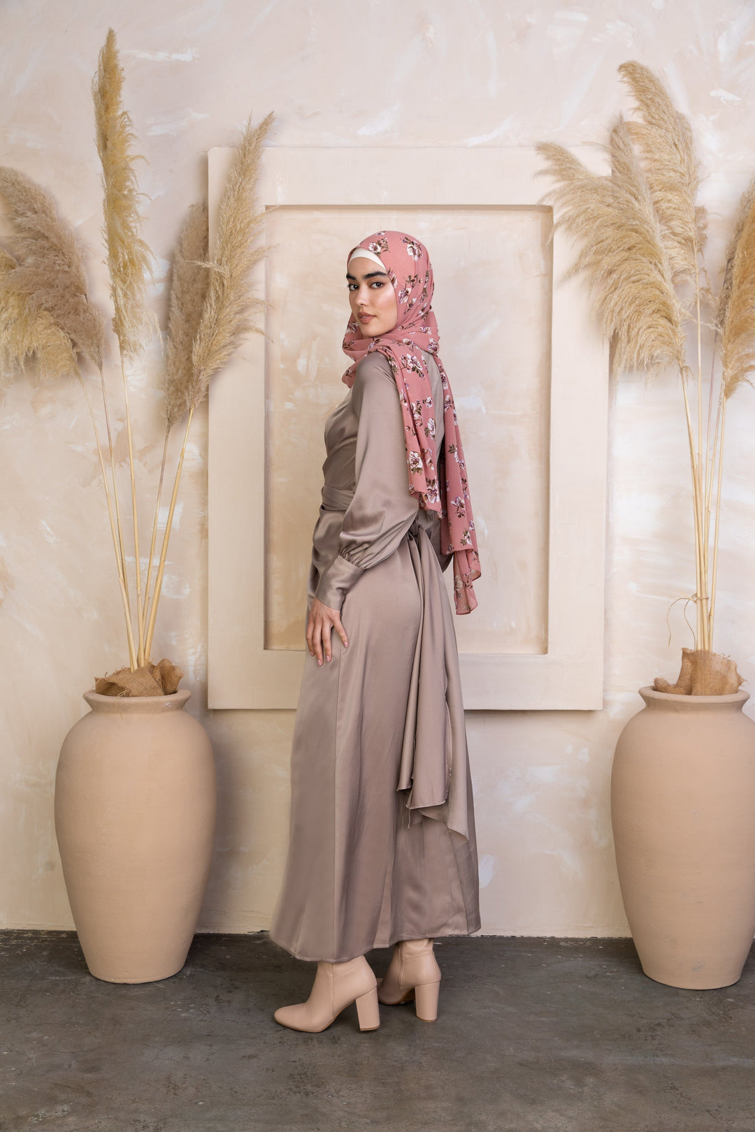 Woman in a satin dress and floral hijab modeling Zana Criss Cross Satin Maxi Dress